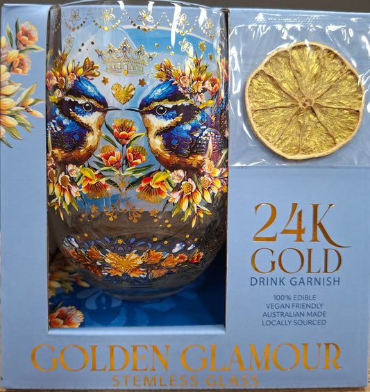 Decorative glass item with floral design and '24K Gold' text on a wooden surface