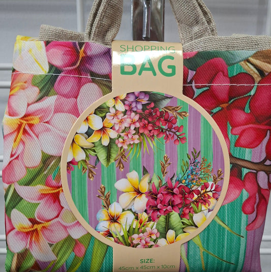 Floral-patterned bag with a visible brand label on a metallic surface