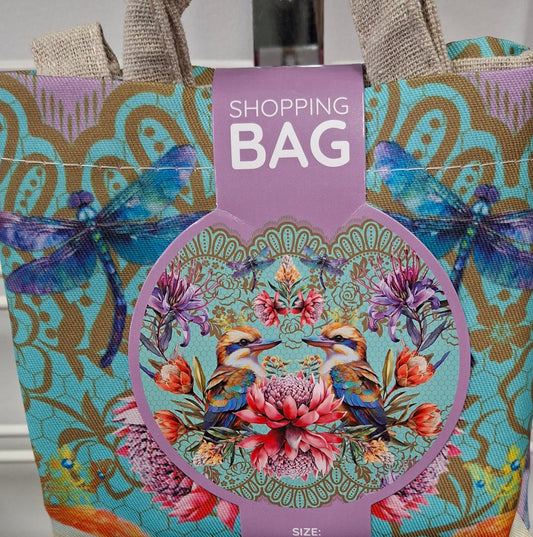 Colorful shopping bag with floral design and 'Shopping Bag' text against a metallic background