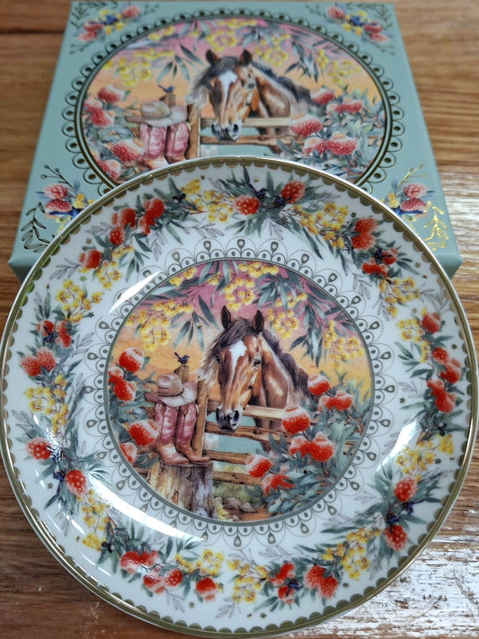 Decorative plate with artistic design on a wooden surface