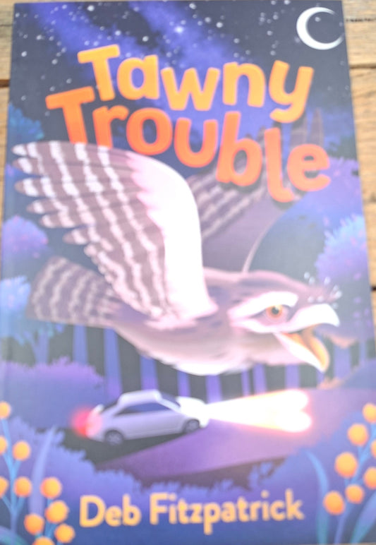 Book cover of 'Tawny Trouble' with an owl illustration on a wooden surface