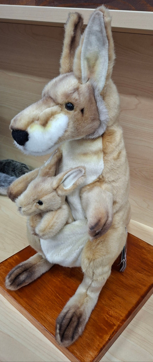Stuffed animal kangaroo on a wooden surface