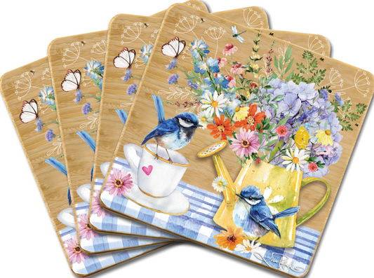 Set of four decorative coasters with floral and bird designs on a white background.