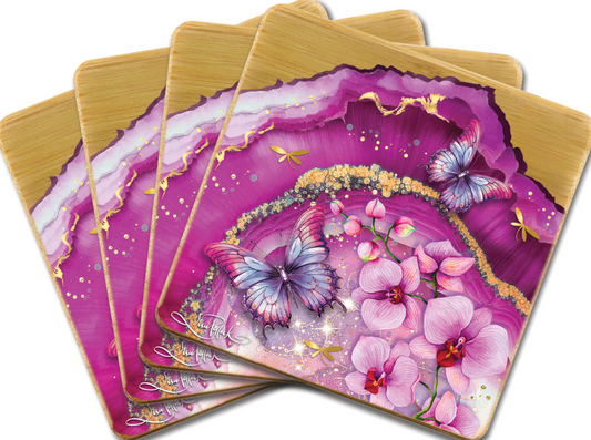 Set of four colorful coasters with butterfly and floral design on a white background