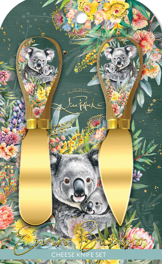 Cheese knife set with gold handles on a floral and koala-themed packaging